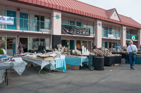 Vendors sell their wares outside their hotel rooms, and sleep in the rooms at night